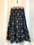 2405067 VE Ribbon Print Pleated Skirt